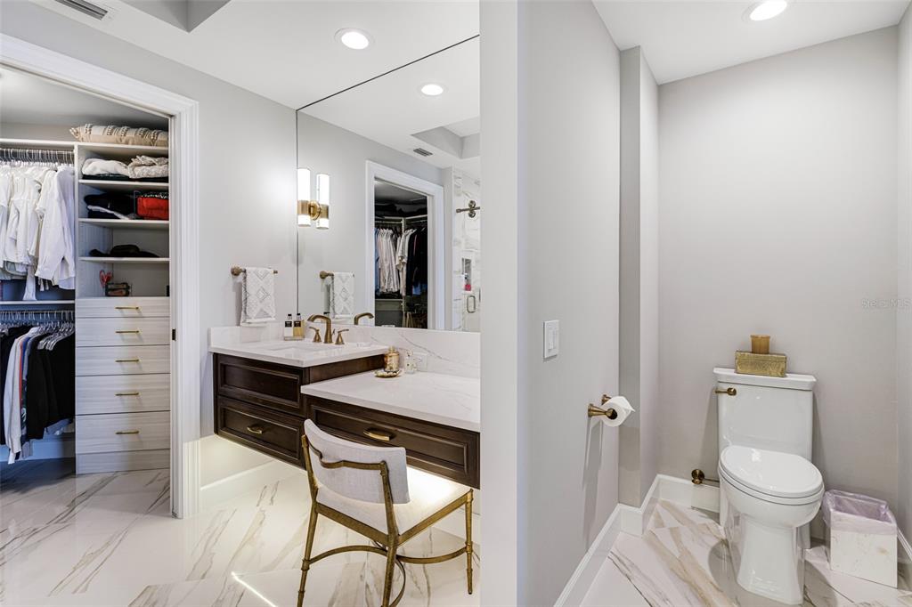 2745 First Street, Unit 1402 Fort Myers, FL 33916 - Photo 19 of 43 a bathroom with a sink a toilet and shower