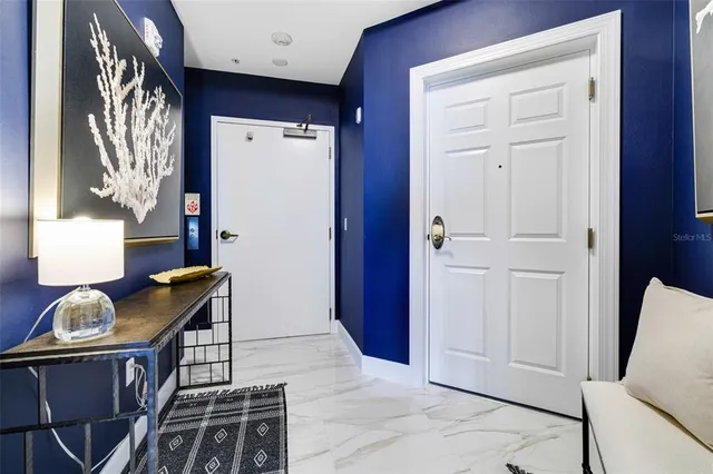 a hallway with furniture and window