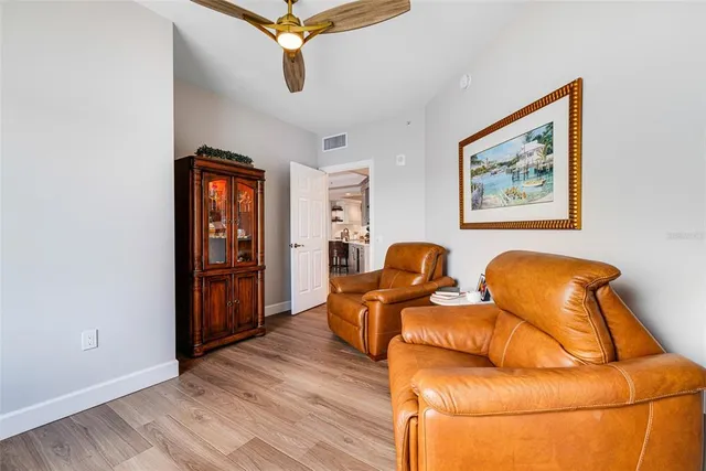a view of a livingroom with furniture and workspace