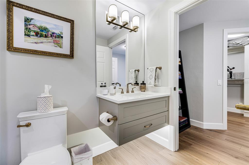 2745 First Street, Unit 1402 Fort Myers, FL 33916 - Photo 25 of 43 a bathroom with a sink mirror and toilet