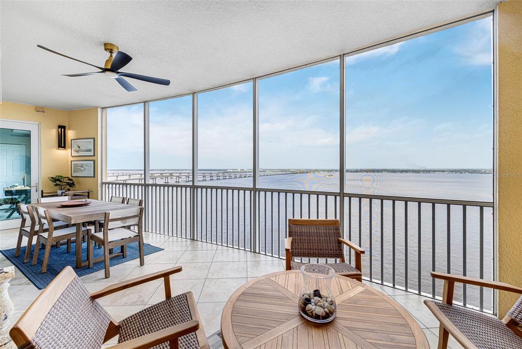 2745 First Street, Unit 1402 Fort Myers, FL 33916 - Photo 32 of 43 a view of a dining room with furniture window and wooden floor