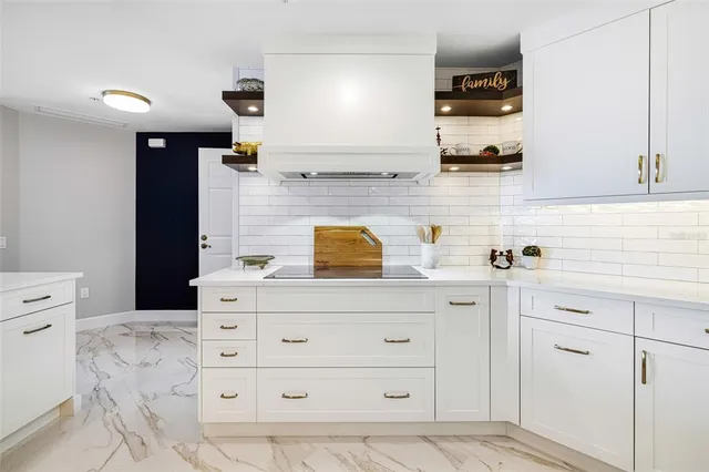 a kitchen with a stove and cabinets