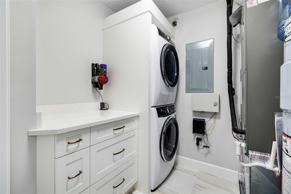2745 First Street, Unit 1402 Fort Myers, FL 33916 - Photo 7 of 43 a utility room with dryer and washer