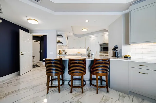 a kitchen with a table and chairs in it