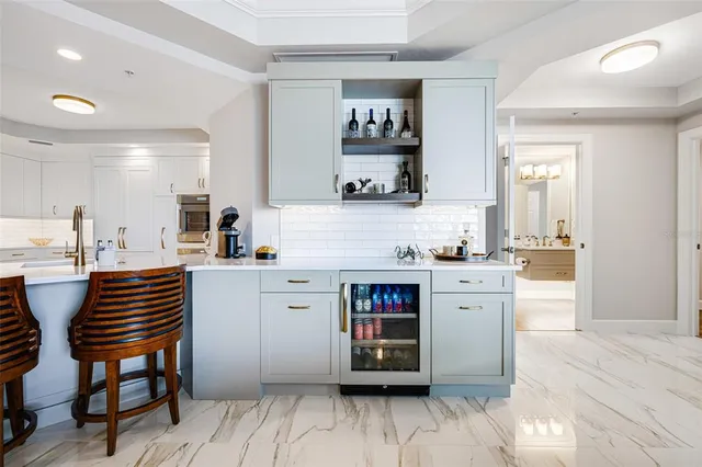 a kitchen with a sink cabinets and wooden floor