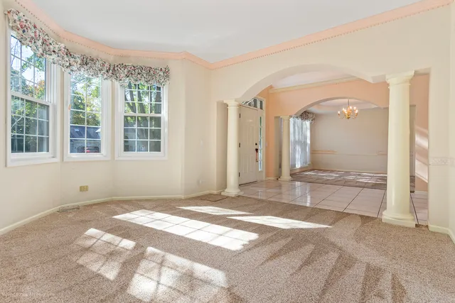 a kitchen with kitchen island granite countertop a sink stove and wooden cabinets