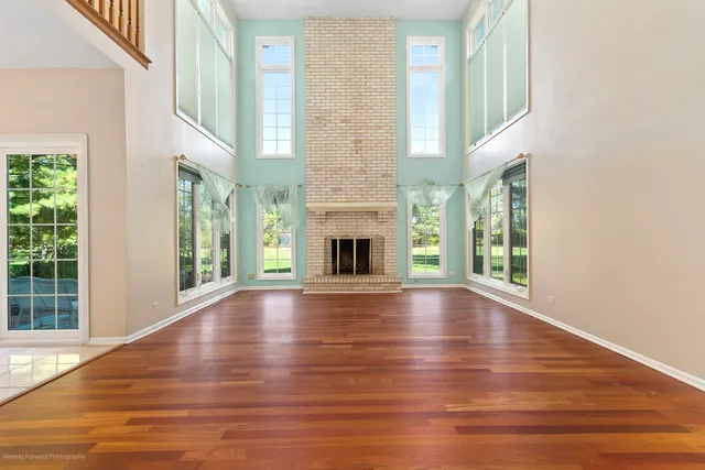 a kitchen with cabinets a center island and stainless steel appliances