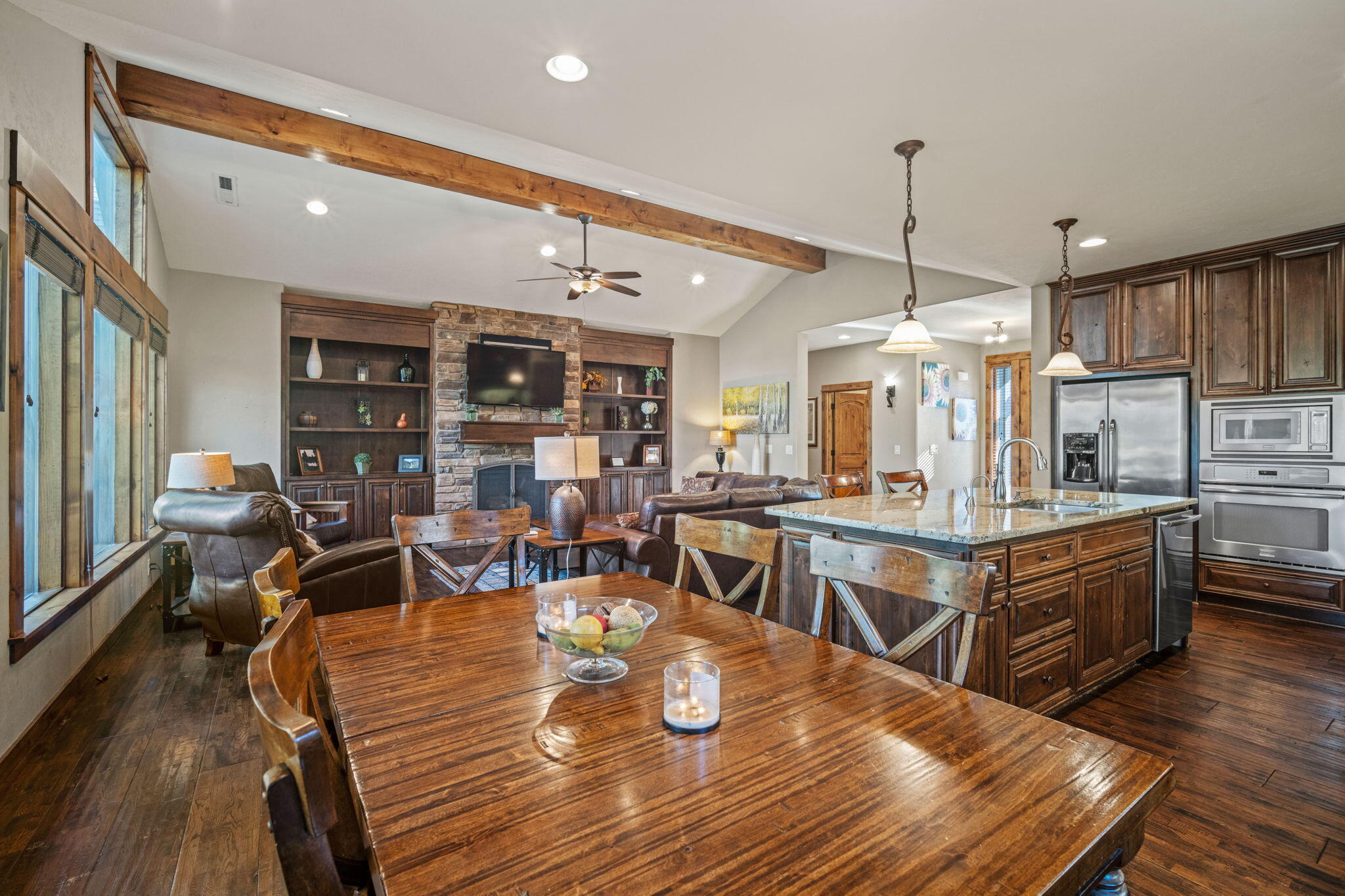 56508 Dancing Rock Loop, Unit 22 Bend, OR 97707 - Photo 16 of 69 a living room with lots of furniture and wooden floor