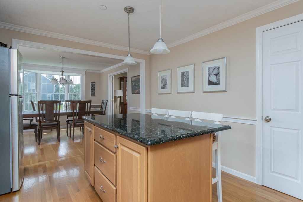 19 Hammond Farm Road Haverhill, MA 01832 - Photo 15 of 42 a kitchen with stainless steel appliances granite countertop a kitchen island a stove and a sink