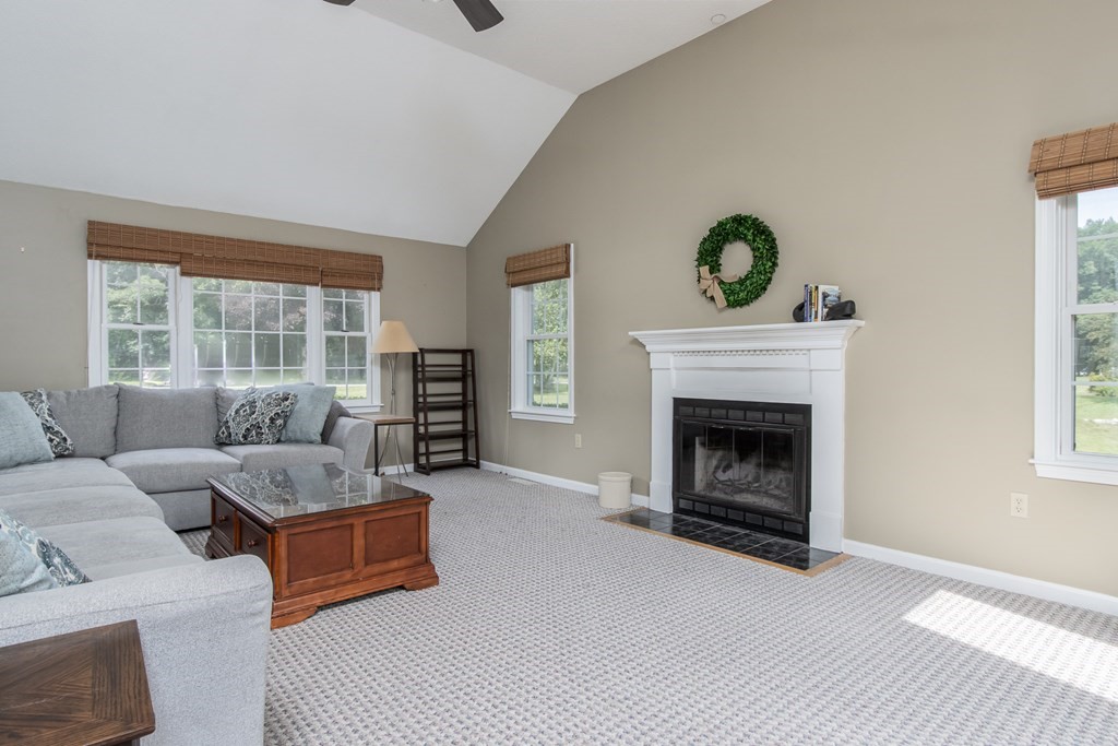 19 Hammond Farm Road Haverhill, MA 01832 - Photo 19 of 42 a living room with furniture and a fireplace
