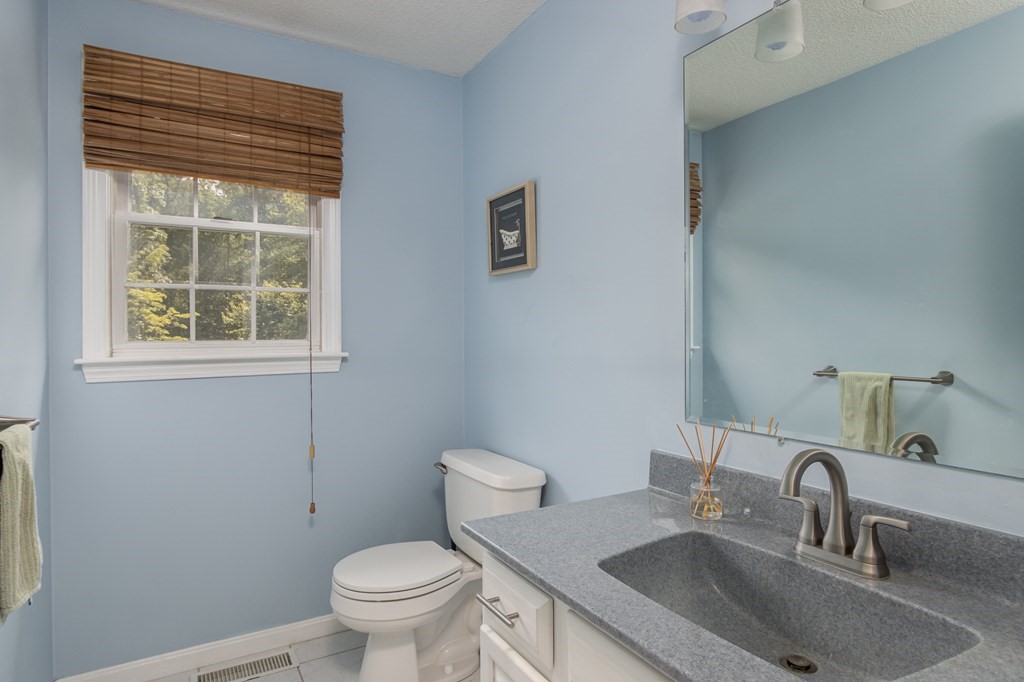 19 Hammond Farm Road Haverhill, MA 01832 - Photo 22 of 42 a bathroom with a toilet a sink and a window