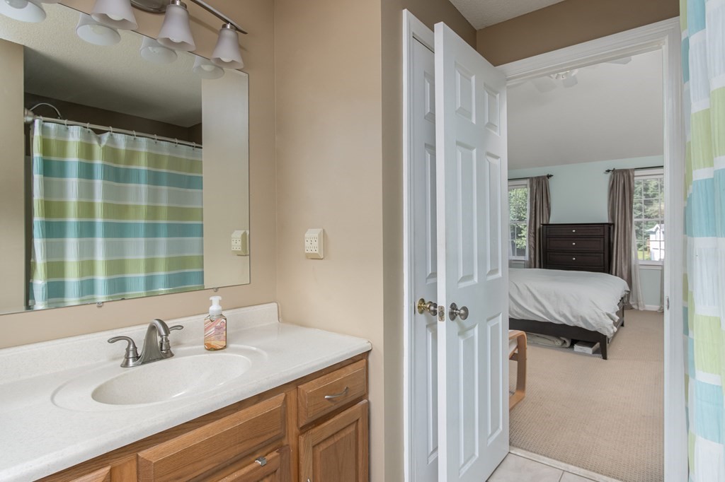 19 Hammond Farm Road Haverhill, MA 01832 - Photo 30 of 42 a en suite bathroom with a granite countertop sink and a mirror