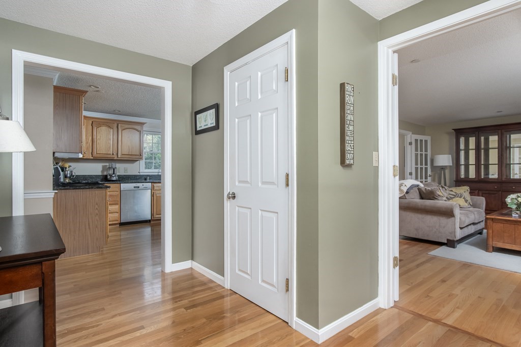 19 Hammond Farm Road Haverhill, MA 01832 - Photo 7 of 42 a view of a living room kitchen and a wooden floor