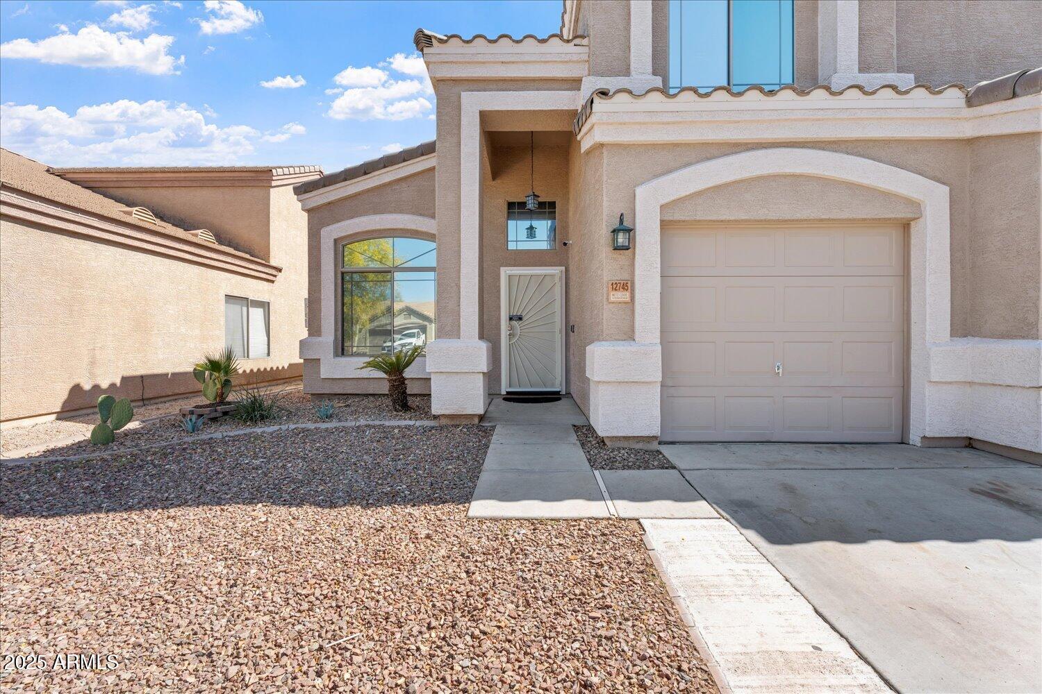 12745 West Calavar Road El Mirage, AZ 85335 - Photo 11 of 56 a view of a entryway door of the house