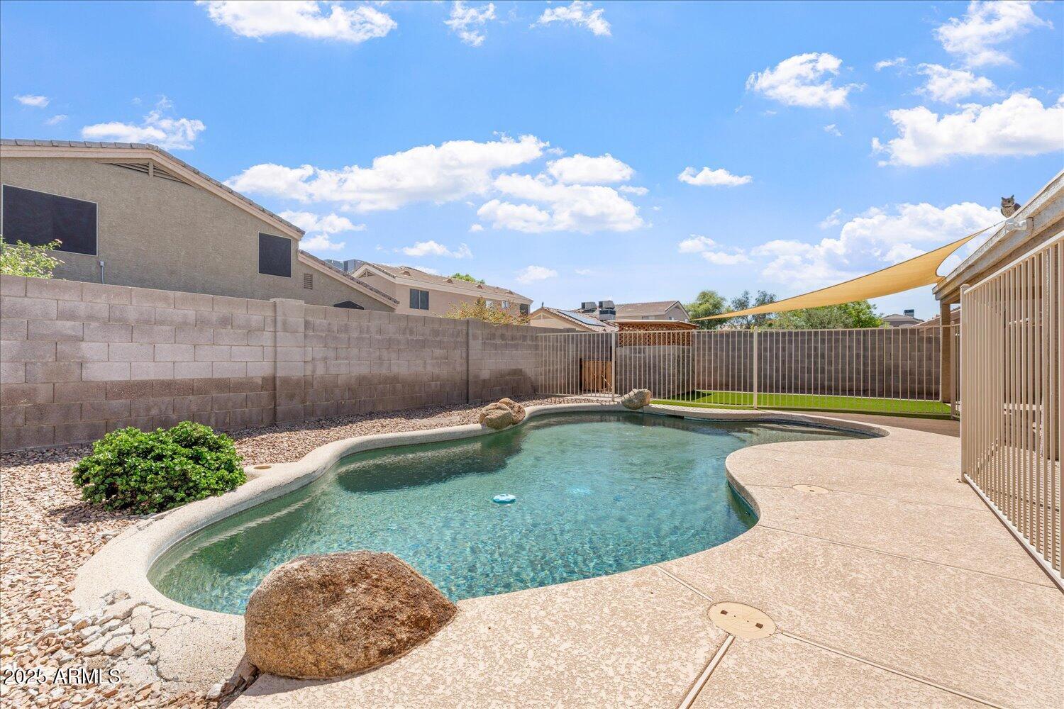 12745 West Calavar Road El Mirage, AZ 85335 - Photo 48 of 56 a view of a backyard