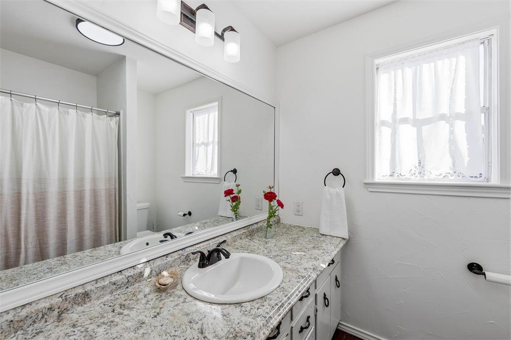 1846 Richerson Road Denison, TX 75021 - Photo 16 of 23 Bathroom with a shower with tub shower and vanity