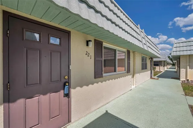 a front view of a house with a large window