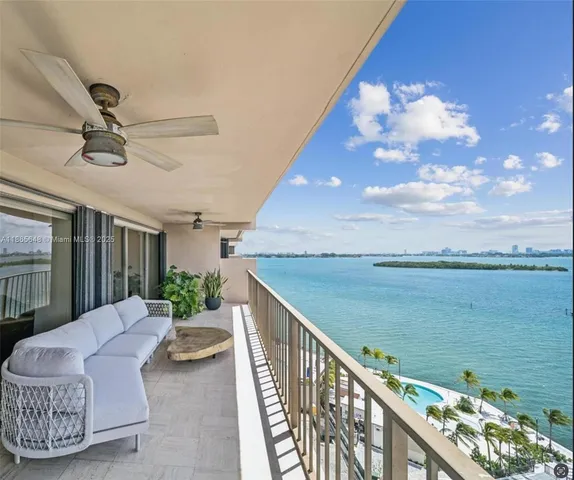 a view of a balcony with furniture