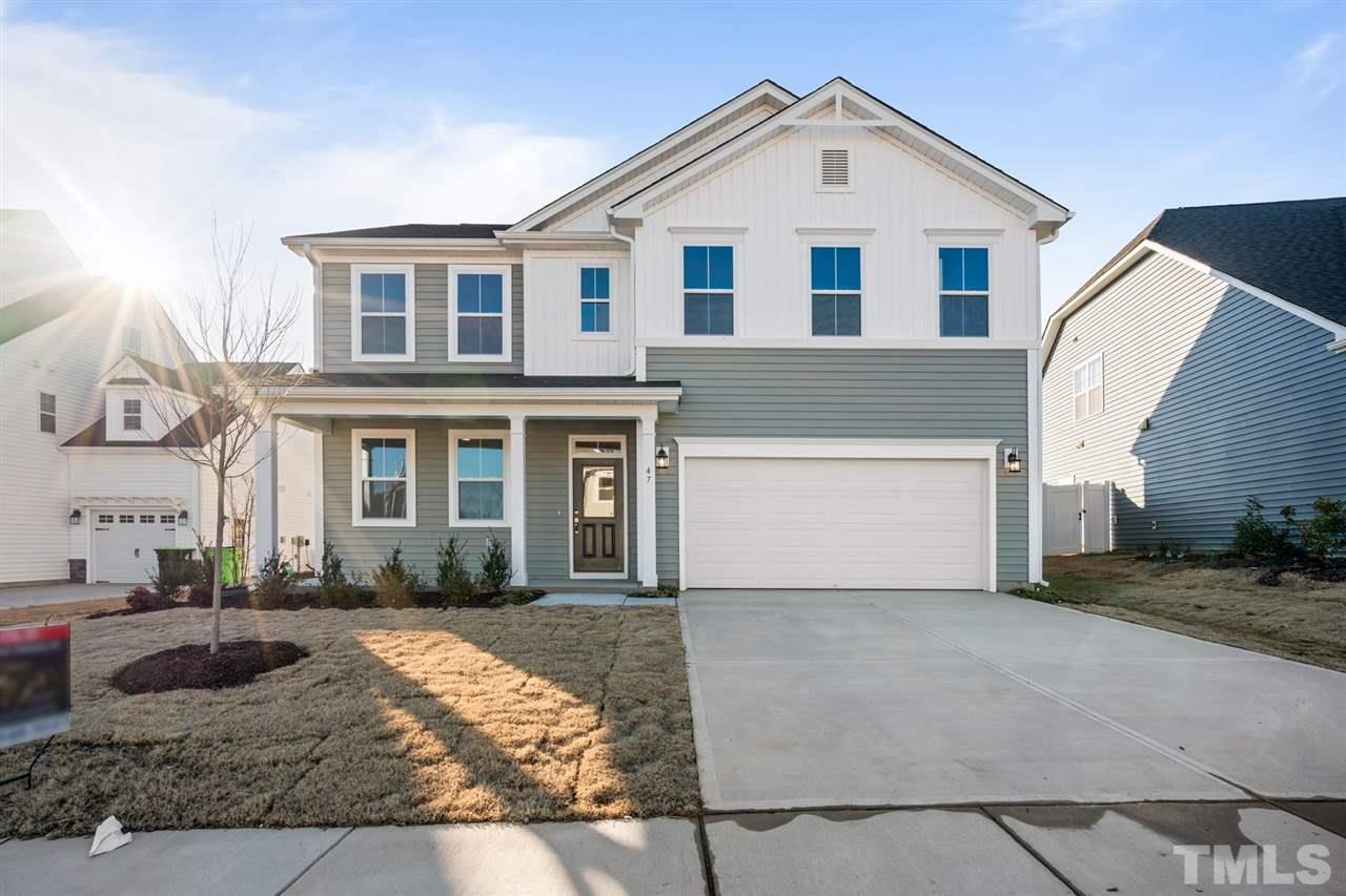 132 Scoville Road Garner, NC 27529 - Photo 2 of 26 a front view of a house with garage