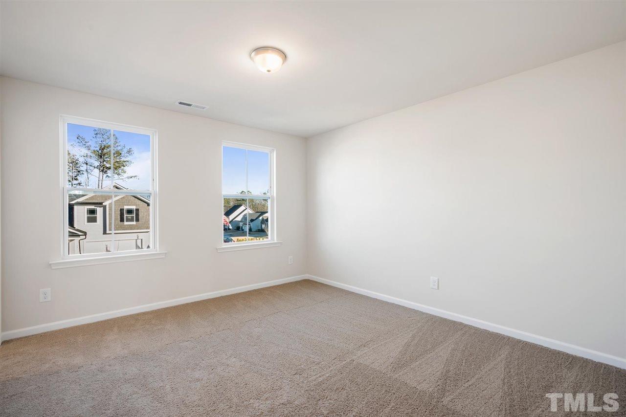 132 Scoville Road Garner, NC 27529 - Photo 12 of 26 an empty room with windows