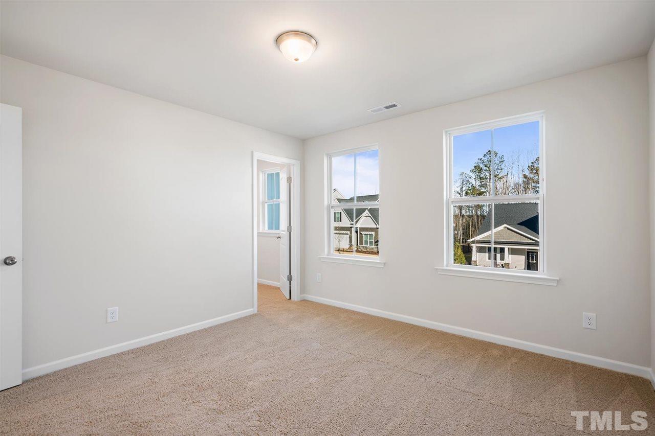 132 Scoville Road Garner, NC 27529 - Photo 13 of 26 an empty room with windows and closet