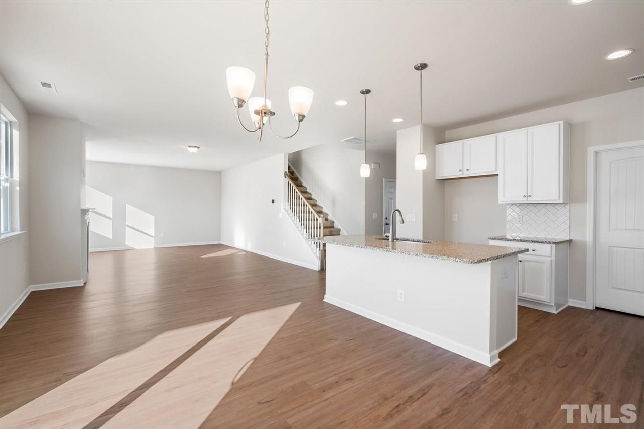 132 Scoville Road Garner, NC 27529 - Photo 23 of 26 a view of kitchen with sink and wooden floor