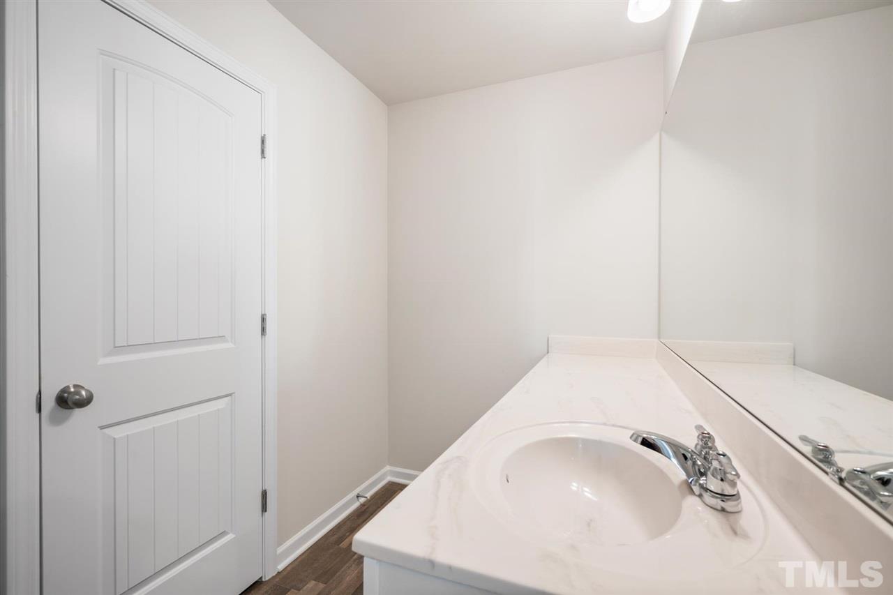 132 Scoville Road Garner, NC 27529 - Photo 7 of 26 a bathroom with a sink and a vanity