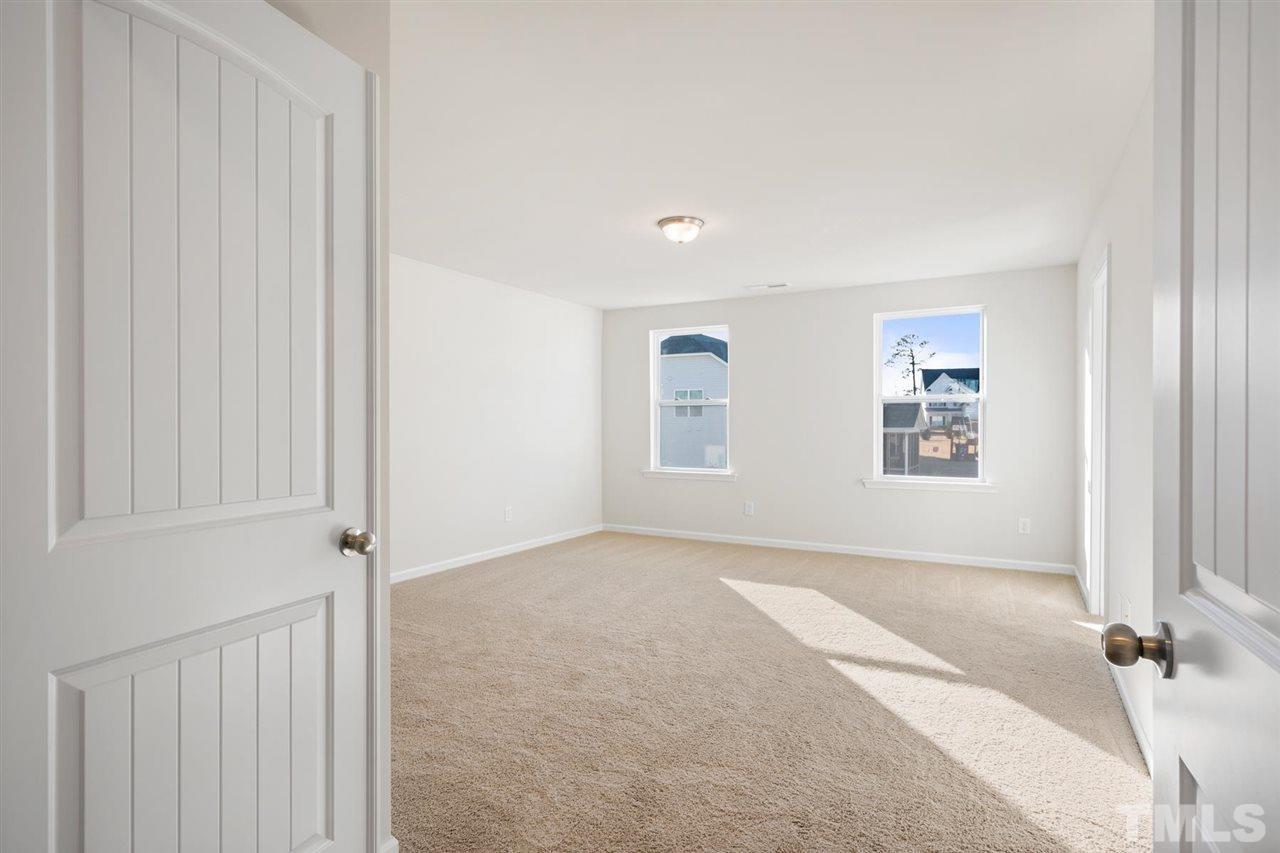 132 Scoville Road Garner, NC 27529 - Photo 10 of 26 an empty room with windows