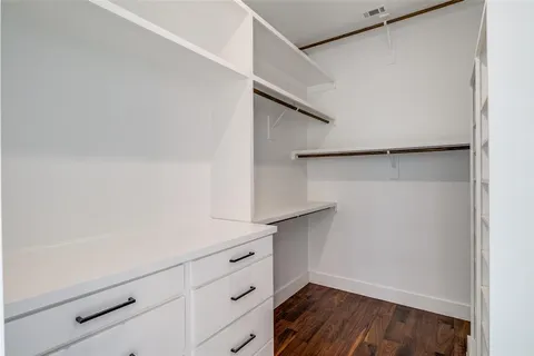a view of an empty walk in closet