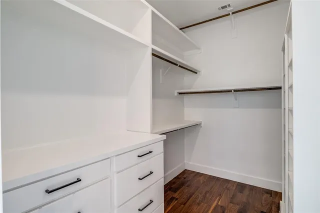 a view of an empty walk in closet