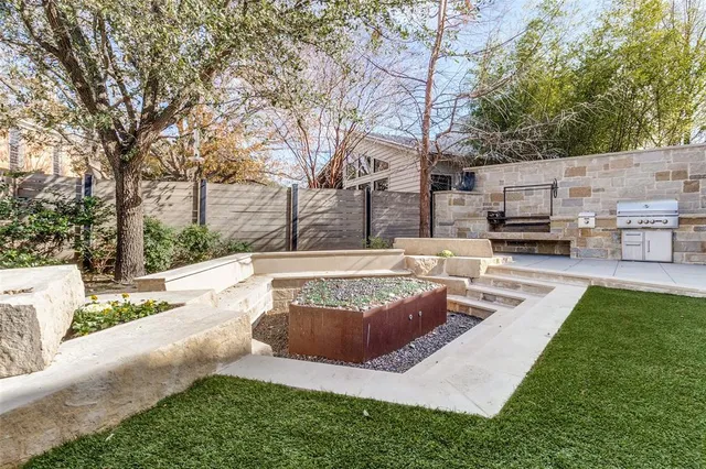 a view of a house with garden and sitting area