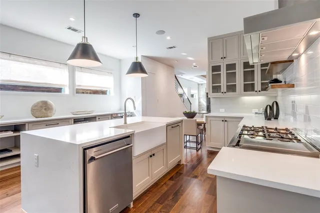 a kitchen with a sink stove and window