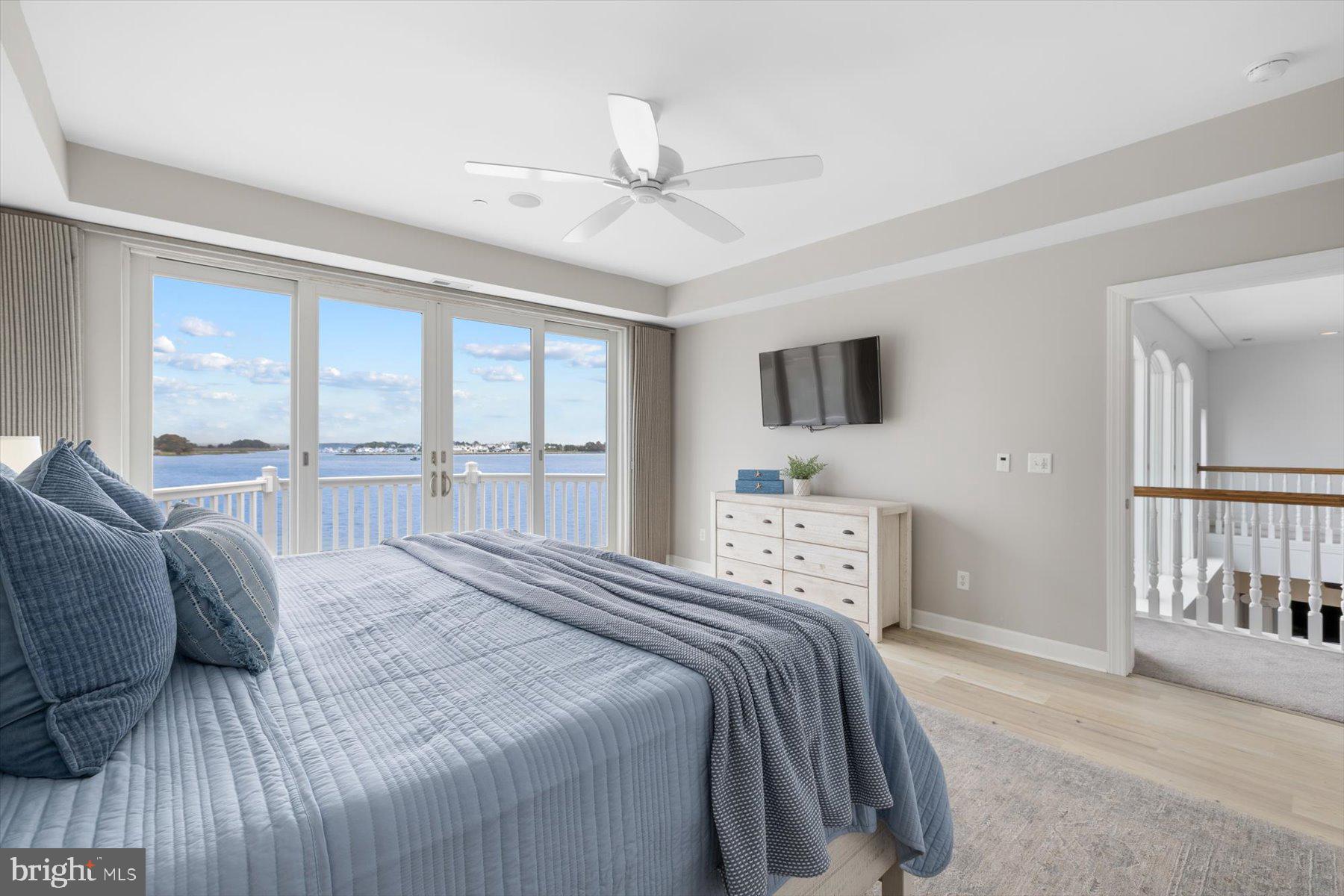 35 Inlet View Court Bethany Beach, DE 19930 - Photo 37 of 74 a bedroom with a large bed and a tv