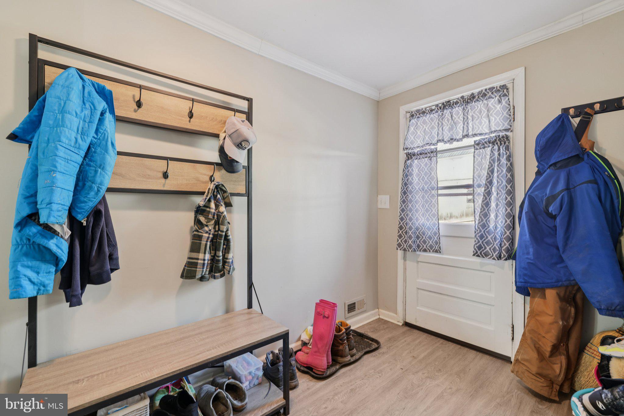 519 North Maple Avenue Brunswick, MD 21716 - Photo 11 of 26 a view of walk in closet with clothes and shoes