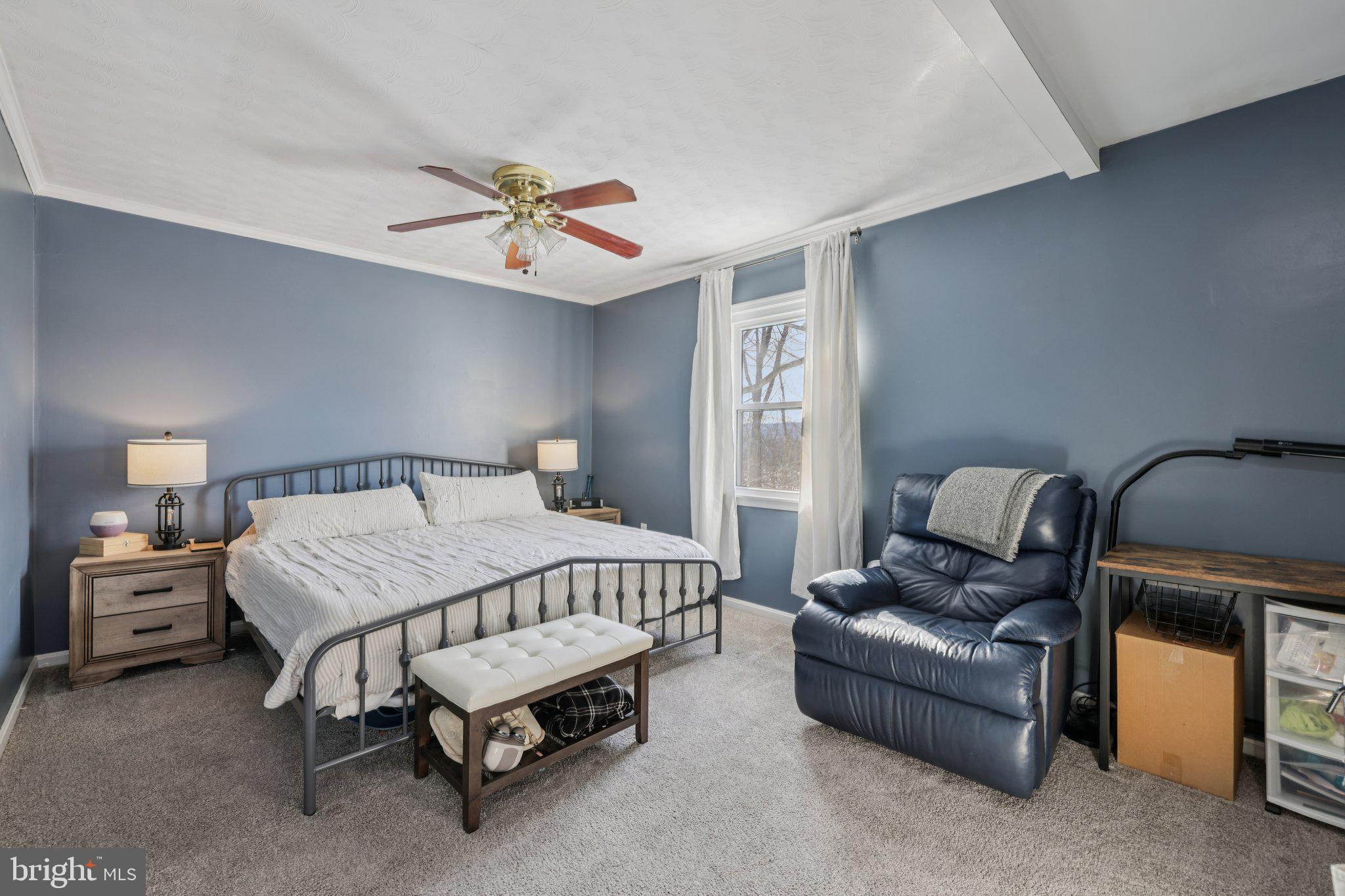 519 North Maple Avenue Brunswick, MD 21716 - Photo 13 of 26 a bedroom with a bed couch and window