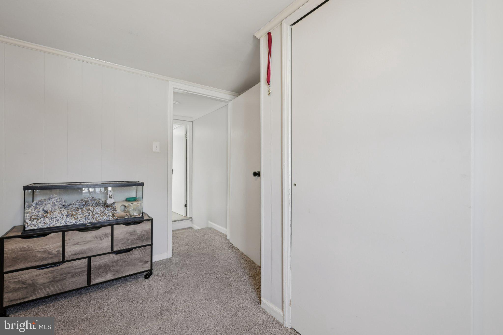 519 North Maple Avenue Brunswick, MD 21716 - Photo 22 of 26 a bedroom with a bed and a window