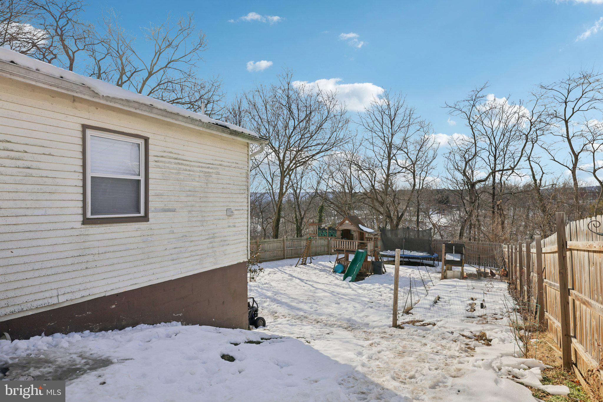 519 North Maple Avenue Brunswick, MD 21716 - Photo 25 of 26 a view of a backyard with table and chairs