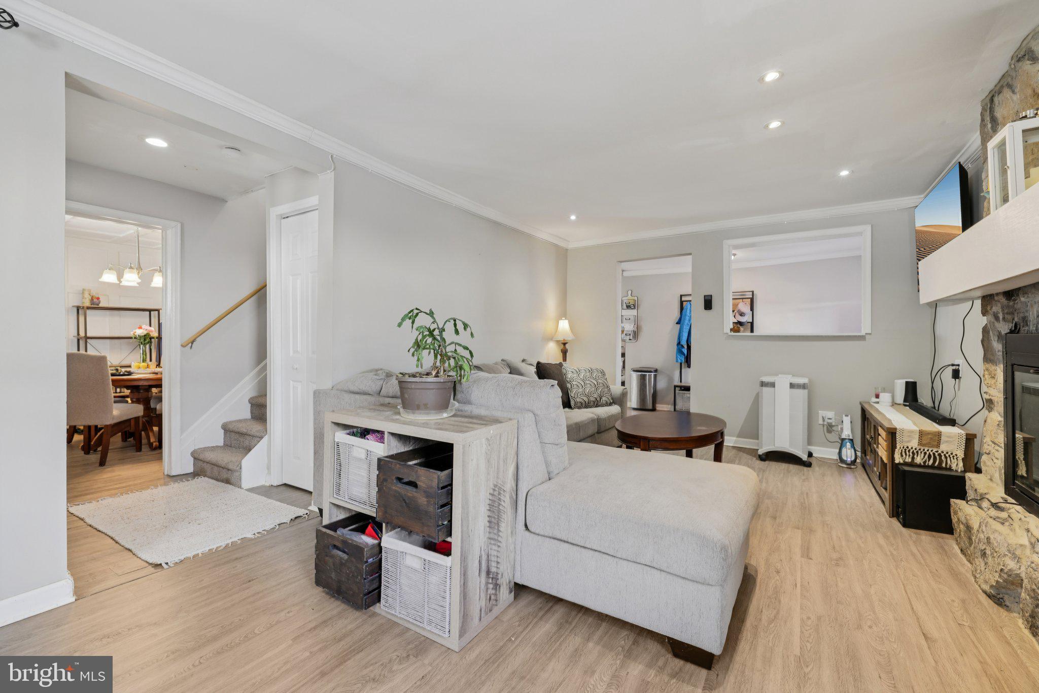 519 North Maple Avenue Brunswick, MD 21716 - Photo 4 of 26 a living room with furniture and a fireplace