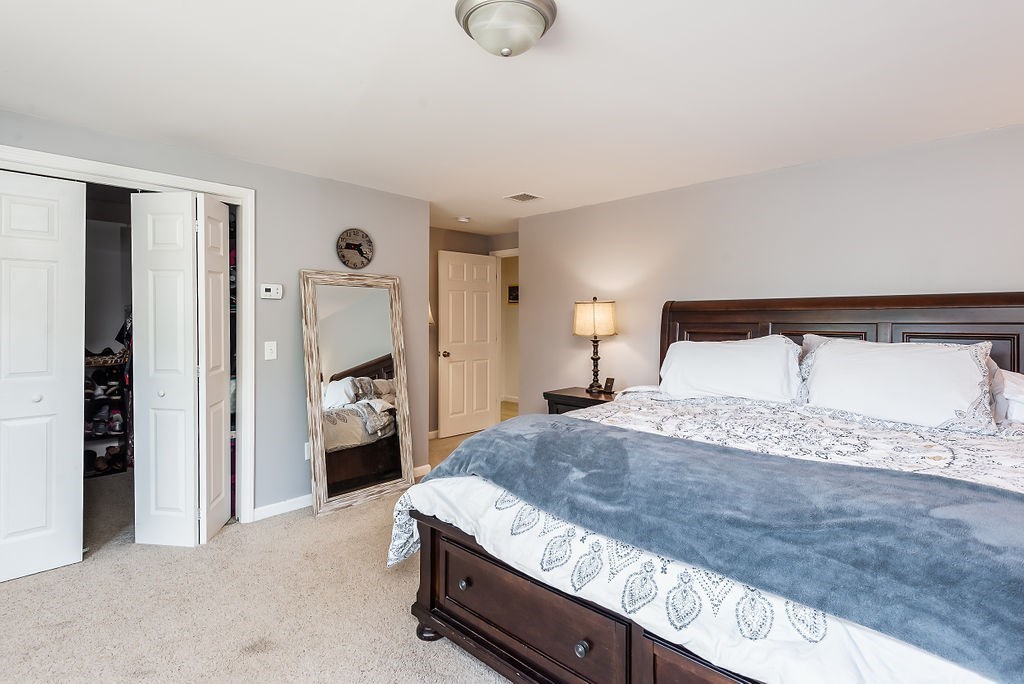 34 Bourne Avenue, Unit A Attleboro, MA 02703 - Photo 19 of 35 a bedroom with a bed and walk in closet