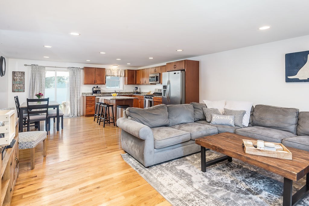 34 Bourne Avenue, Unit A Attleboro, MA 02703 - Photo 2 of 35 a living room with furniture kitchen view and a table