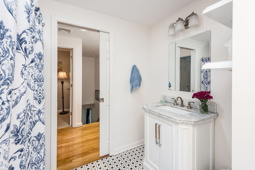 34 Bourne Avenue, Unit A Attleboro, MA 02703 - Photo 21 of 35 a bathroom with a sink and a mirror
