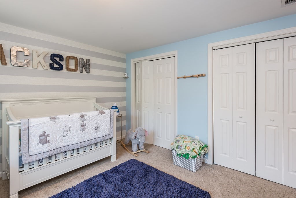 34 Bourne Avenue, Unit A Attleboro, MA 02703 - Photo 22 of 35 a bedroom with a bed and a window