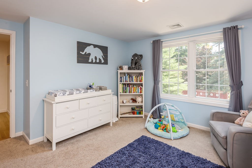 34 Bourne Avenue, Unit A Attleboro, MA 02703 - Photo 24 of 35 a view of a bedroom with workspace and a window