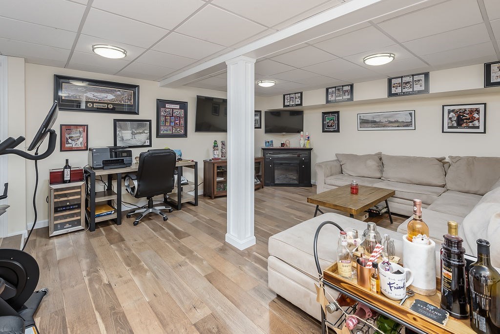 34 Bourne Avenue, Unit A Attleboro, MA 02703 - Photo 26 of 35 a living room with furniture kitchen view and a flat screen tv