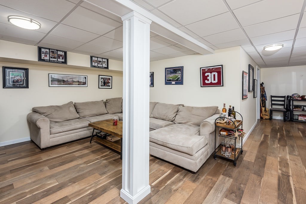 34 Bourne Avenue, Unit A Attleboro, MA 02703 - Photo 27 of 35 a living room with furniture and a wooden floor