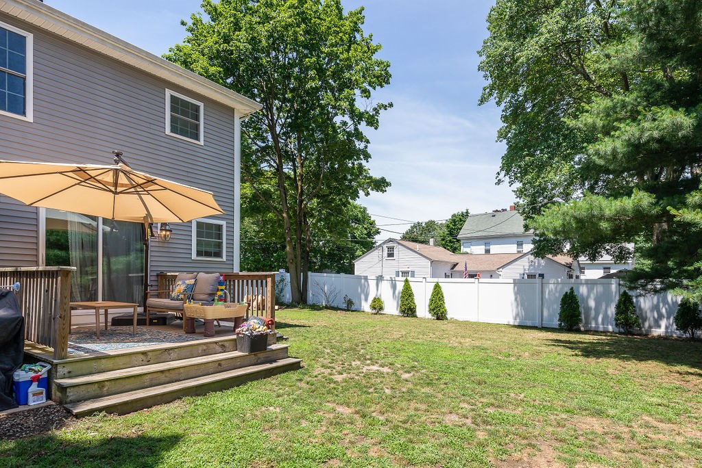 34 Bourne Avenue, Unit A Attleboro, MA 02703 - Photo 30 of 35 a house view with a sitting space and garden