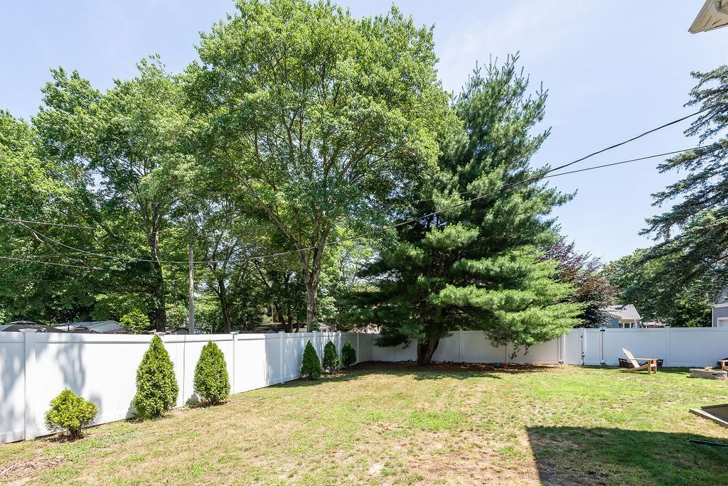 34 Bourne Avenue, Unit A Attleboro, MA 02703 - Photo 33 of 35 a view of a swimming pool and trees in the background