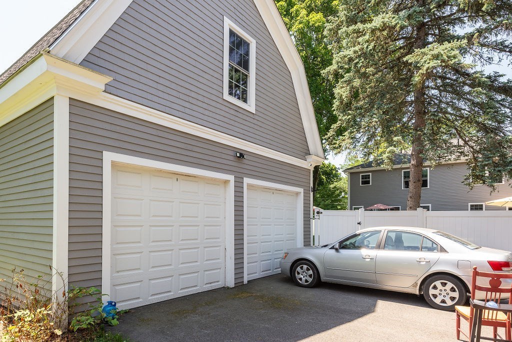 34 Bourne Avenue, Unit A Attleboro, MA 02703 - Photo 34 of 35 a white building that has a tree in front of it
