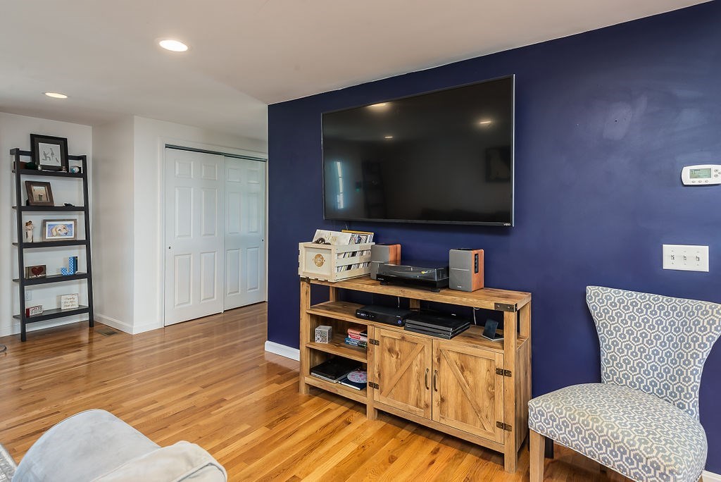 34 Bourne Avenue, Unit A Attleboro, MA 02703 - Photo 5 of 35 a view of a workspace with furniture and wooden floor