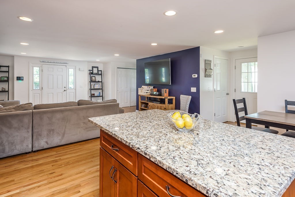 34 Bourne Avenue, Unit A Attleboro, MA 02703 - Photo 6 of 35 a kitchen with stainless steel appliances granite countertop a sink and a wooden cabinets
